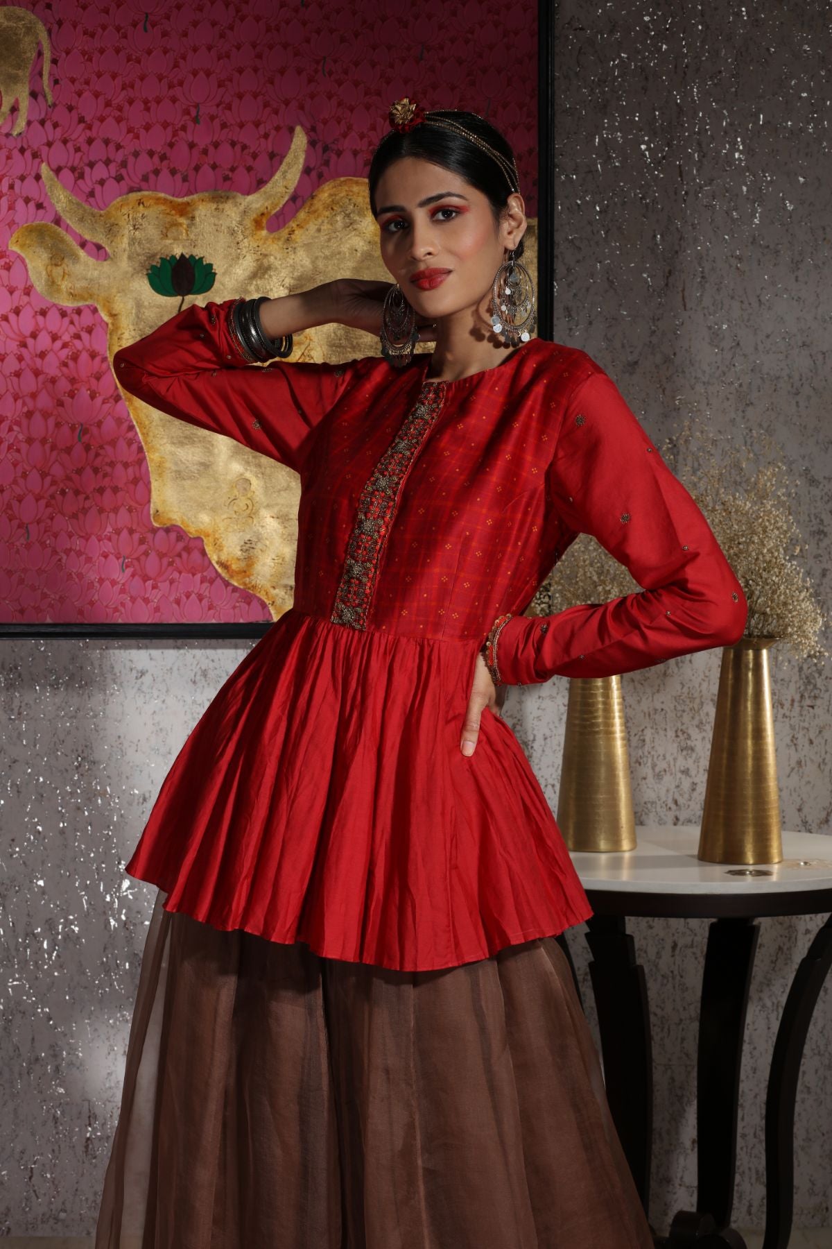 Sandhya peplum top teamed with flared organza palazzos – Neeta